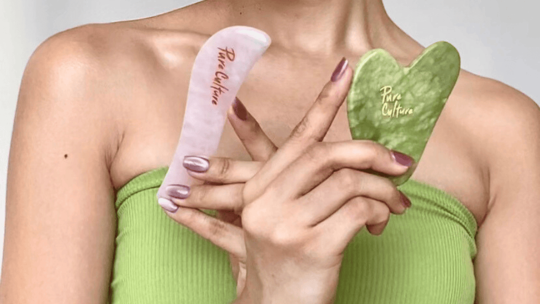 Woman holding gua sha