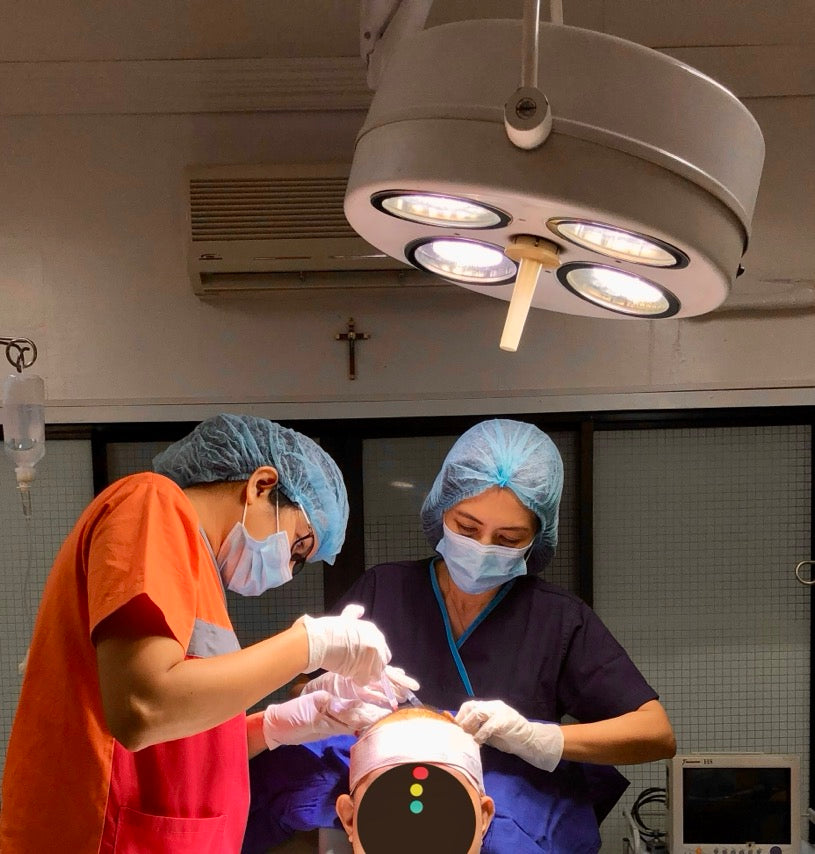 Dra Emma during a hair restoration procedure.